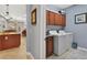 Convenient laundry room featuring a washer, dryer, and built-in cabinets at 1556 Blue Grass Blvd, Deland, FL 32724