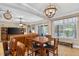 Living room and dining area with hardwood floors and ample natural light at 1556 Blue Grass Blvd, Deland, FL 32724