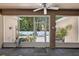 Cozy sunroom with view of the lush backyard oasis, perfect for relaxation and enjoying the outdoors at 1556 Blue Grass Blvd, Deland, FL 32724