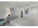 Bright bedroom with a large window, a dresser, and a comfy chair at 1721 Germakian Ln, The Villages, FL 32163