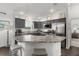 Spacious kitchen featuring a breakfast bar, stainless steel appliances, and ample counter space at 1721 Germakian Ln, The Villages, FL 32163