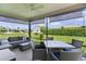 Screened patio offering comfortable seating and a table for outdoor dining at 1721 Germakian Ln, The Villages, FL 32163