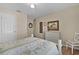 Charming bedroom featuring a ceiling fan, cozy bed, and classic white dresser at 17355 Se 110Th Ter, Summerfield, FL 34491