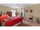 Cozy bedroom with a comfy bed, ceiling fan, windows and natural light at 17355 Se 110Th Ter, Summerfield, FL 34491