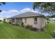 Lush landscaping complements the home's exterior, enhancing its curb appeal at 17355 Se 110Th Ter, Summerfield, FL 34491