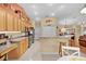 Spacious kitchen with stone countertops, stainless steel appliances, and breakfast bar at 17355 Se 110Th Ter, Summerfield, FL 34491