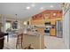 Modern kitchen featuring stainless steel appliances and a breakfast bar at 17355 Se 110Th Ter, Summerfield, FL 34491