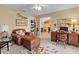 Comfortable home office with a workspace and cozy seating area, creating a versatile and functional space at 17355 Se 110Th Ter, Summerfield, FL 34491