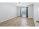 Clean bedroom with window, tile floors, neutral walls, and standard ceiling fan at 17824 Se 87Th Bourne Ave, The Villages, FL 32162