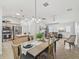 Open concept kitchen and dining area with modern appliances and seamless flow to the living room at 17824 Se 87Th Bourne Ave, The Villages, FL 32162
