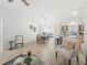 Bright living area showcasing tile floors, a dining space, and an open layout into the kitchen at 17824 Se 87Th Bourne Ave, The Villages, FL 32162