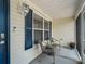 Cozy screened-in porch featuring comfortable seating and a view of the outdoors at 17824 Se 87Th Bourne Ave, The Villages, FL 32162