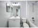 The bathroom has a shower-tub combination and a white vanity with mirror at 2019 Newtown Rd, Groveland, FL 34736