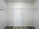 Well-organized closet space with wire shelving, offering efficient storage solutions and clean design at 2019 Newtown Rd, Groveland, FL 34736