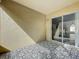 Cozy covered patio with stylish tile flooring and sliding glass doors to the interior at 2019 Newtown Rd, Groveland, FL 34736