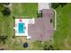 Aerial view showcasing the home, pool, and spacious backyard, highlighting the expansive outdoor living and entertaining areas at 23247 Lake Seneca Rd, Eustis, FL 32736