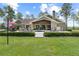 Expansive backyard features a pristine pool, spa and outdoor dining area, perfect for entertaining and enjoying outdoor living at 23247 Lake Seneca Rd, Eustis, FL 32736