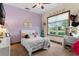 Purple themed bedroom with natural light at 23247 Lake Seneca Rd, Eustis, FL 32736