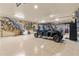 Spacious garage interior with vehicle, mounted animal decorations, and ample room for storage and hobbies at 23247 Lake Seneca Rd, Eustis, FL 32736