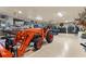Spacious garage interior featuring large tools, animal decorations, cabinets and ample space for storage and hobbies at 23247 Lake Seneca Rd, Eustis, FL 32736