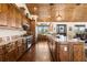 A full view of this kitchen shows lots of cabinet space, granite counters and stainless steel appliances at 23247 Lake Seneca Rd, Eustis, FL 32736