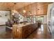 This home offers a great open layout with a gourmet kitchen, living room fireplace, and dining area at 23247 Lake Seneca Rd, Eustis, FL 32736