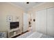 Comfortable bedroom featuring a large closet, ceiling fan, and stylish decor at 2400 Pawtucket Pass, Mount Dora, FL 32757