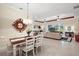 Open concept dining and living area featuring tile flooring and natural light at 2400 Pawtucket Pass, Mount Dora, FL 32757