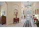 Spacious foyer with tile floors and a decorative chandelier near the front door at 2400 Pawtucket Pass, Mount Dora, FL 32757