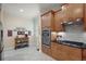 Modern kitchen featuring stainless appliances, double oven, cooktop, and tile flooring at 2400 Pawtucket Pass, Mount Dora, FL 32757