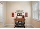 Kitchen with tiled floors, rolling kitchen island and light-colored walls at 2400 Pawtucket Pass, Mount Dora, FL 32757
