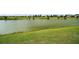 A beautiful backyard pond creates a scenic and tranquil setting at 2400 Pawtucket Pass, Mount Dora, FL 32757