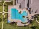 Aerial view of a large swimming pool with lap lanes and a uniquely shaped recreational area at 2400 Pawtucket Pass, Mount Dora, FL 32757