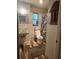 A cozy bathroom showcases a classic sink, toilet and tropical themed shower curtain at 2433 Adams Ave, Deltona, FL 32738