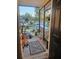 Inviting screened front porch, decorated with potted plants and a decorative rug, welcomes visitors at 2433 Adams Ave, Deltona, FL 32738