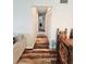 Hallway with wood-look flooring leading to the bedrooms and featuring a double closet at 2433 Adams Ave, Deltona, FL 32738