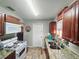 Updated kitchen featuring sleek countertops, stainless steel appliances, and ample cabinet space at 2433 Adams Ave, Deltona, FL 32738