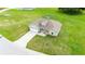 An aerial shot showcases a well maintained home nestled in a lush, green landscape at 2495 Se 75Th Blvd, Bushnell, FL 33513