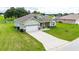 Lovely home with a two car garage, nice landscaping, and a long driveway on a generous lot at 2495 Se 75Th Blvd, Bushnell, FL 33513