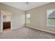 Bright bedroom with carpet, two windows and fresh paint plus attached bathroom at 2495 Se 75Th Blvd, Bushnell, FL 33513
