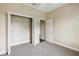 Bright bedroom features neutral carpeting, a walk-in closet, and fresh paint throughout at 2495 Se 75Th Blvd, Bushnell, FL 33513