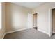 Cozy bedroom featuring neutral carpet, fresh paint and an en-suite bathroom at 2495 Se 75Th Blvd, Bushnell, FL 33513
