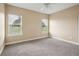 Bright bedroom with carpet, two windows and fresh paint at 2495 Se 75Th Blvd, Bushnell, FL 33513