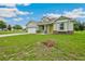 Charming single-Gathering home featuring a well-manicured lawn and attached two-car garage at 2495 Se 75Th Blvd, Bushnell, FL 33513