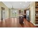 Spacious kitchen with granite countertops, stainless steel appliances, and dark wood cabinetry at 2495 Se 75Th Blvd, Bushnell, FL 33513