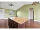 Spacious kitchen with center island and a chandelier above at 2495 Se 75Th Blvd, Bushnell, FL 33513