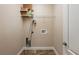 Neutral laundry room with tile floor and wire shelving at 2495 Se 75Th Blvd, Bushnell, FL 33513