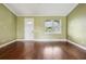 Bright living room boasts hardwood floors, large windows, and modern finishes at 2495 Se 75Th Blvd, Bushnell, FL 33513