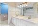 A bathroom featuring a dual vanity, a shower, and a separate bathtub at 25025 Cranes Roost Cir, Leesburg, FL 34748