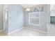A dining area features natural light from a window decorated with a floral valance at 25025 Cranes Roost Cir, Leesburg, FL 34748